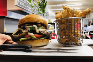 Burger with avocado and chips